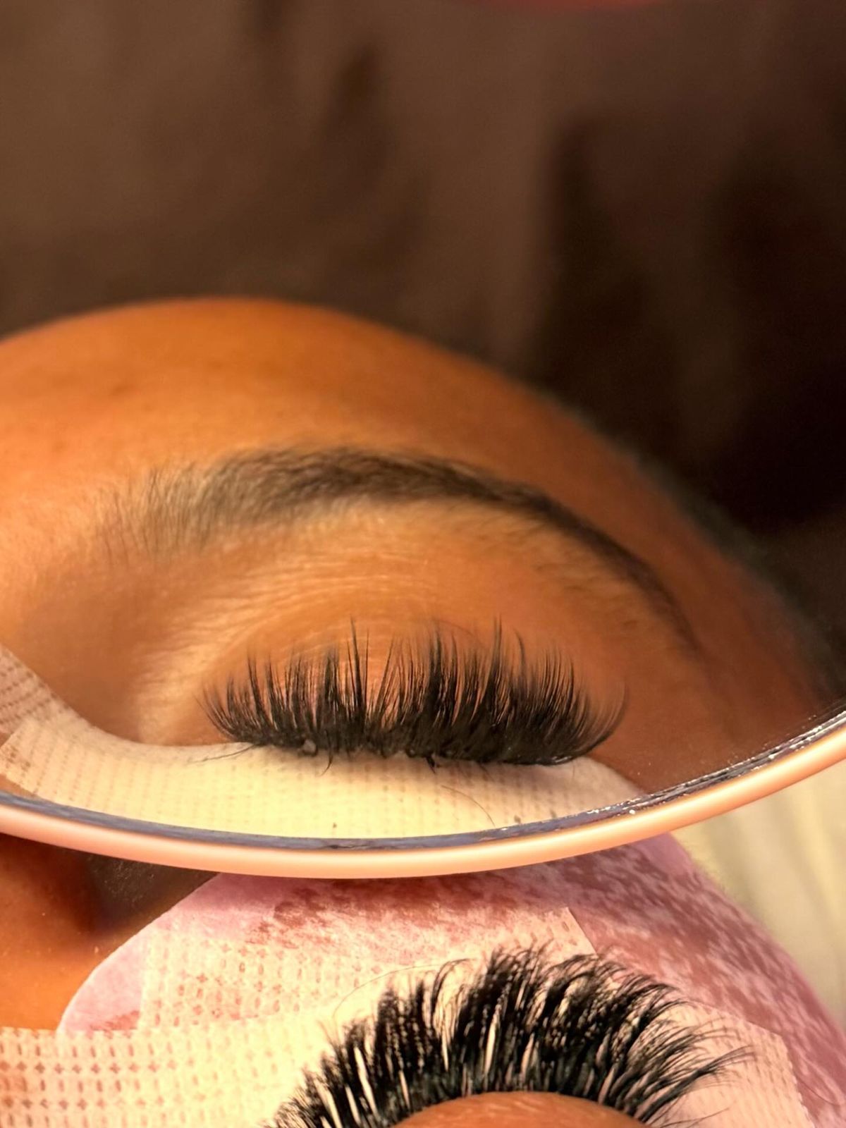 Full volume lash set reflected in a mirror