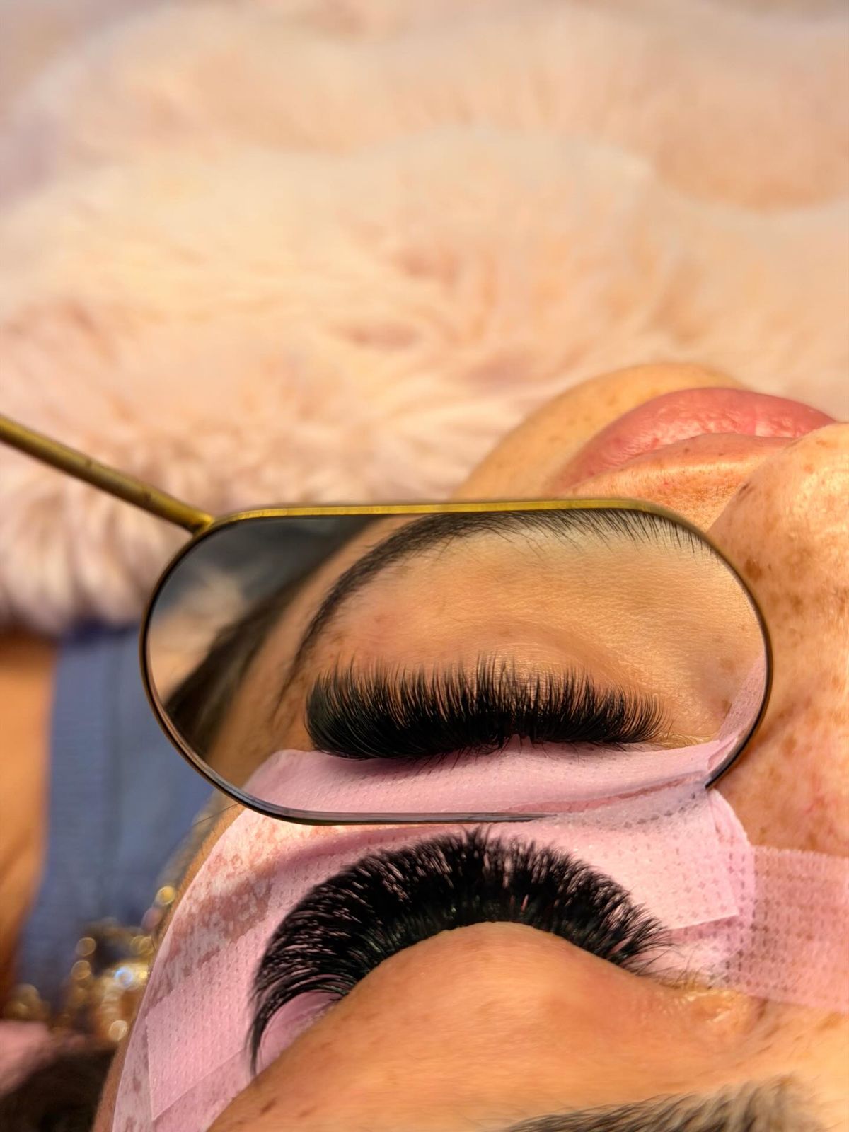 Volume set in a gold mirror over pink pads