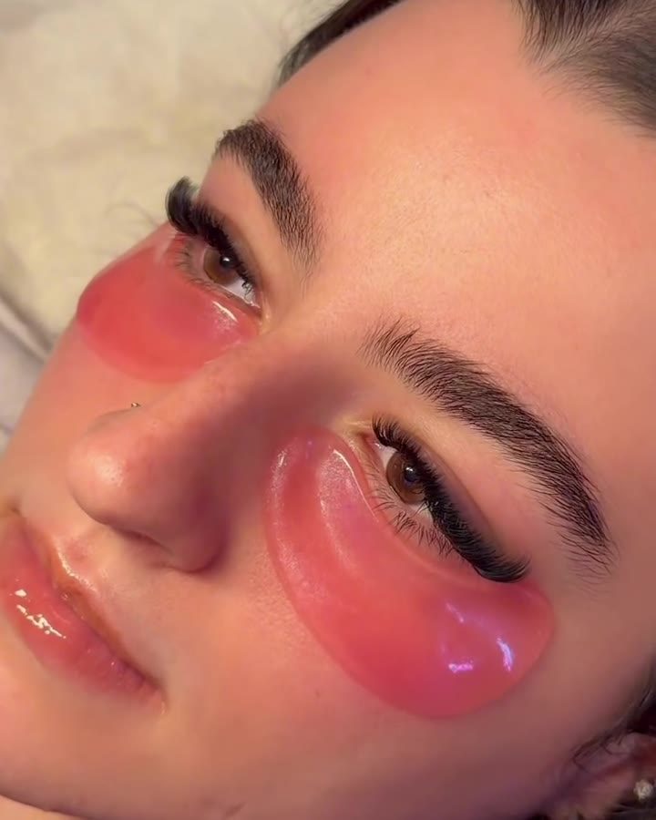 Client relaxing with gel eye patches after her set